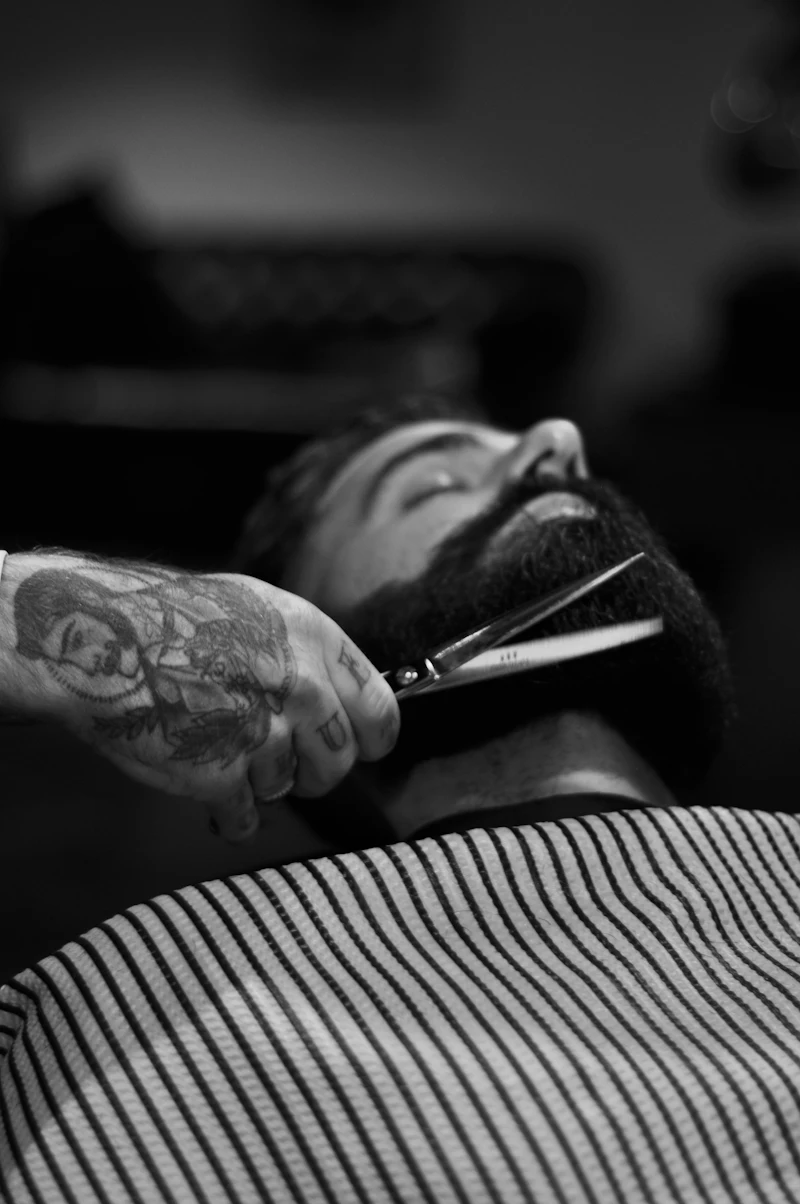 Beard being sculpted with scissors