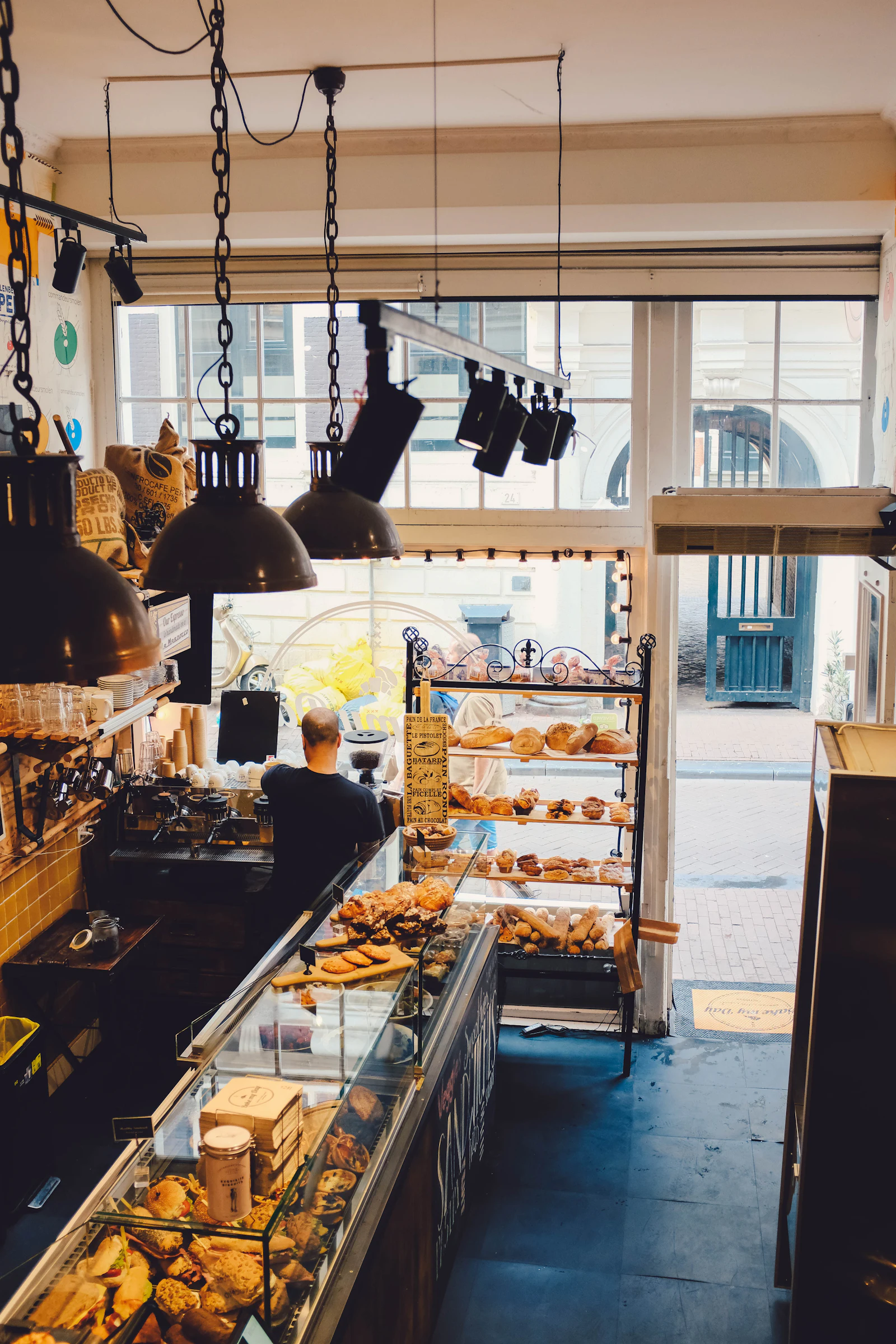 Inside the bakery, with racks of pastries